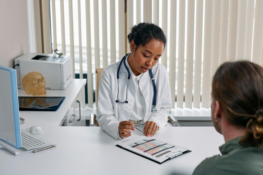 Female consultant speaking with a patient at a gynaecology clinic in Birmingham in a private setting