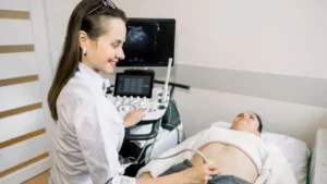 Pelvic health physiotherapist performing an ultrasound assessment on a patient