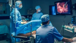 Doctors performing laparoscopic oophorectomy surgery in Birmingham operating theatre