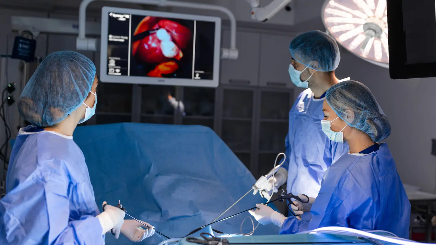 Surgeons performing laparoscopic myomectomy surgery in Birmingham hospital